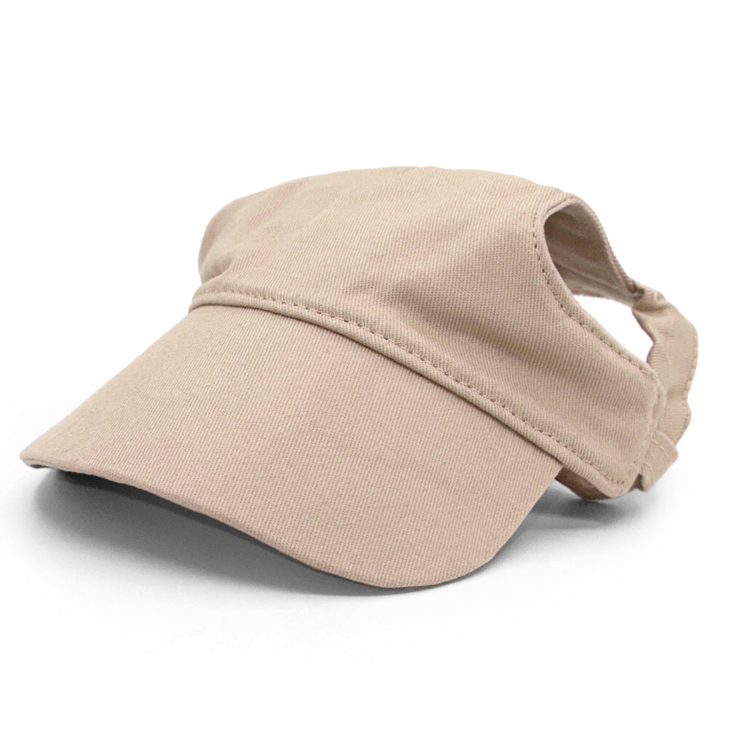A dog wearing a beige cotton adventure dog hat with a patch on it.