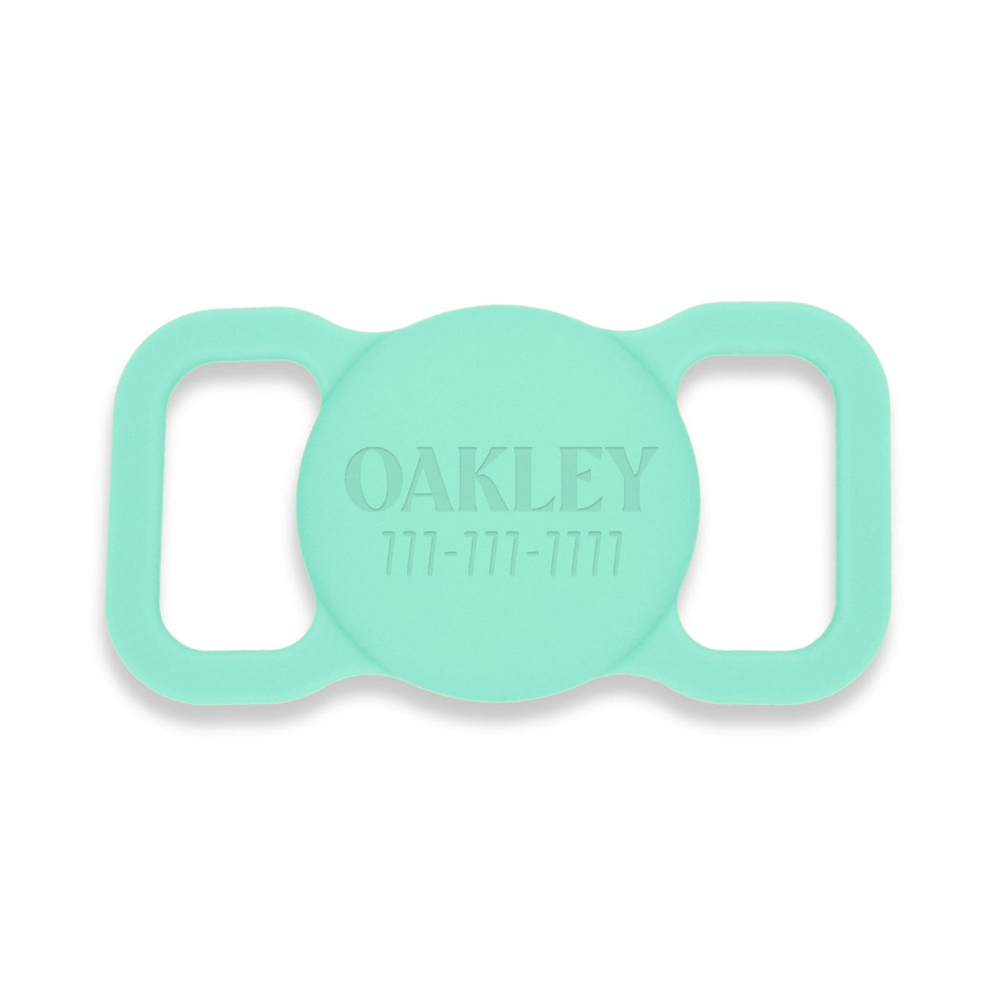 Aqua silicone AirTag holder. Pet's name and a phone # is engraved on the front.