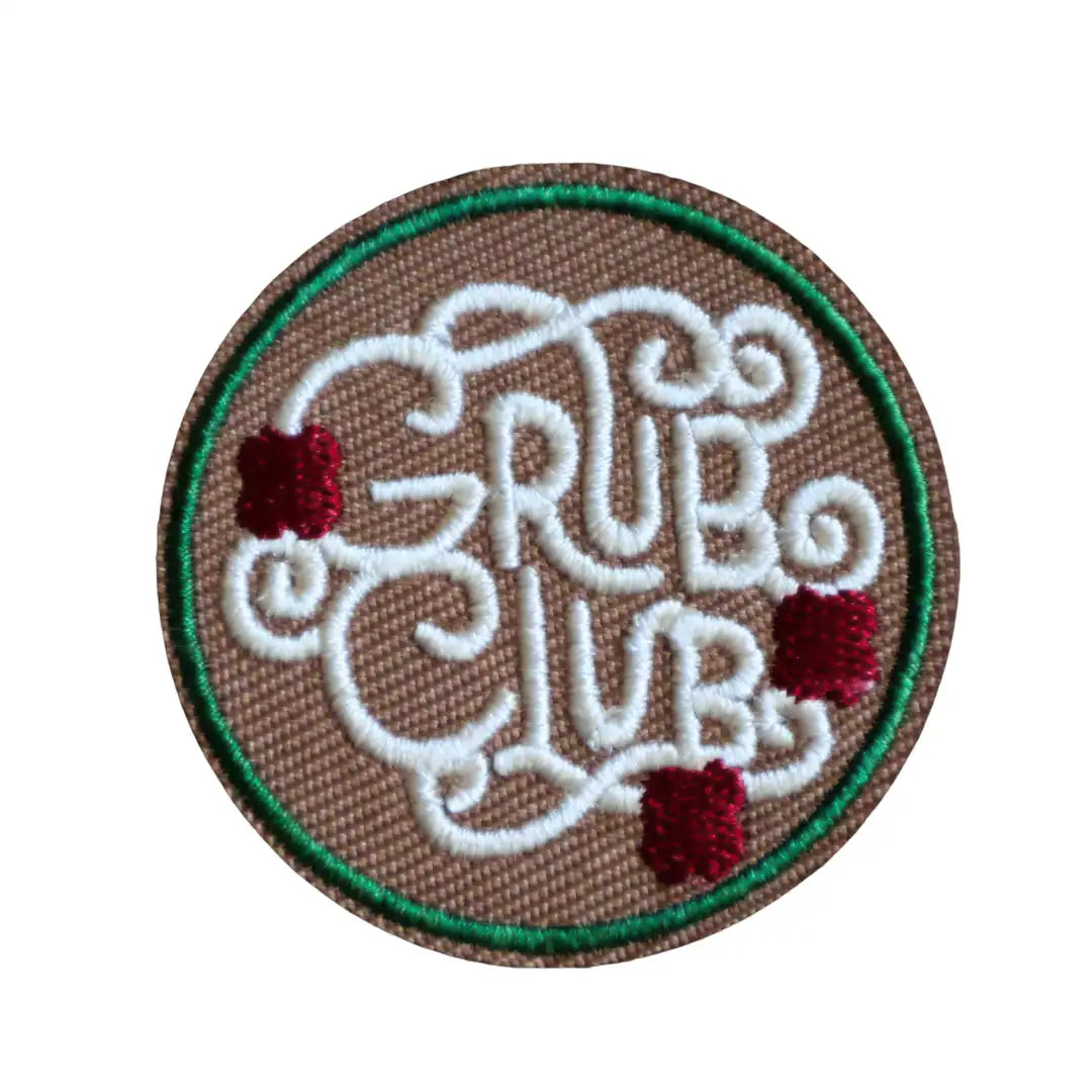 Round Iron-on patch with 'Grub Club' text and spaghetti design on a brown background