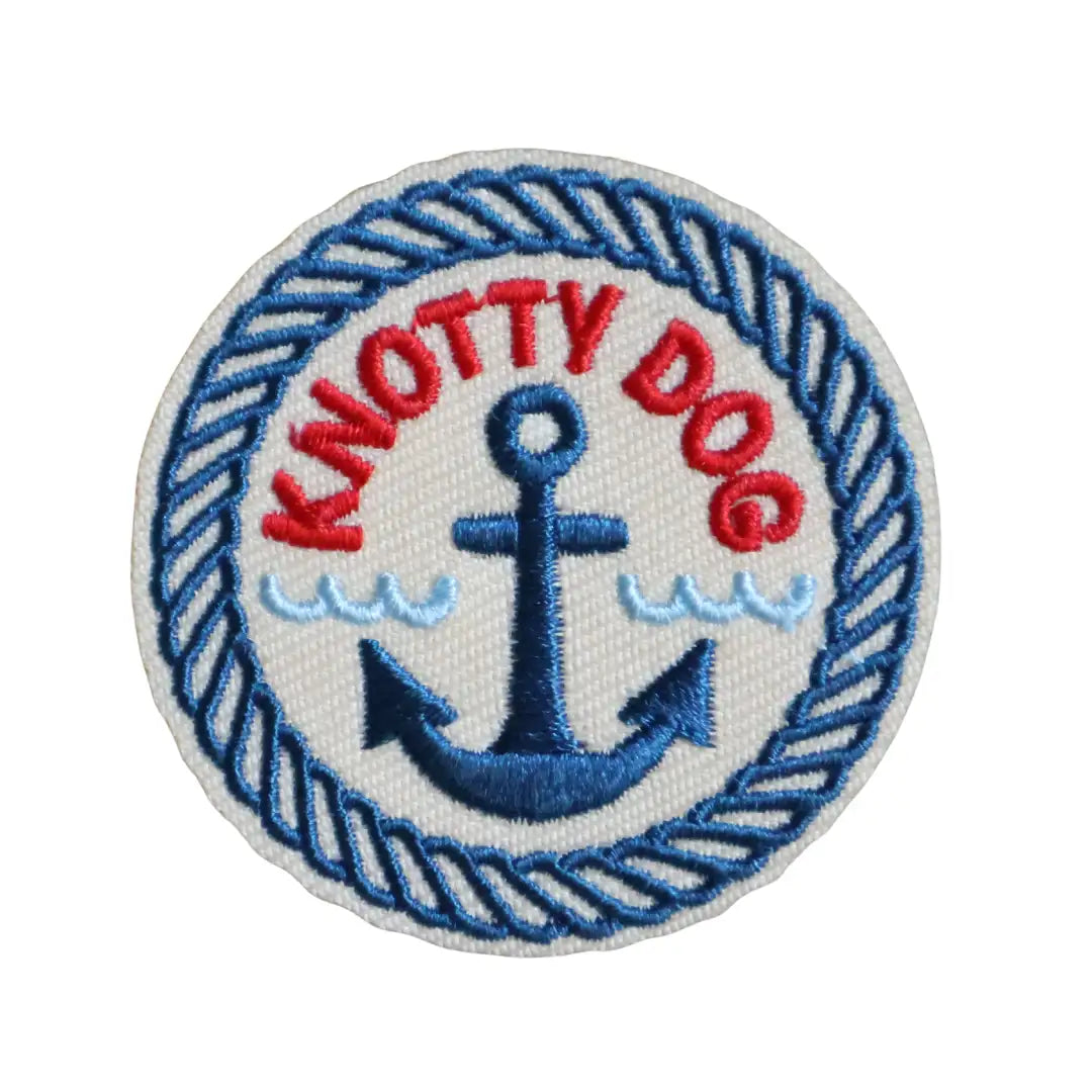 Circular Iron-on patch with 'Knotty Dog' text and anchor and rope design on a white background